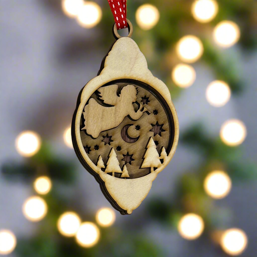 Lantern shaped Christmas ornament with an angel layered design