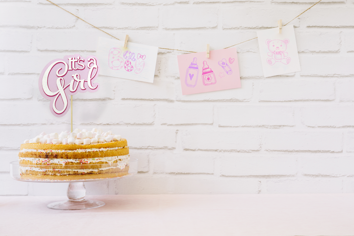 'It's a Girl' non-edible cake topper in pink and white