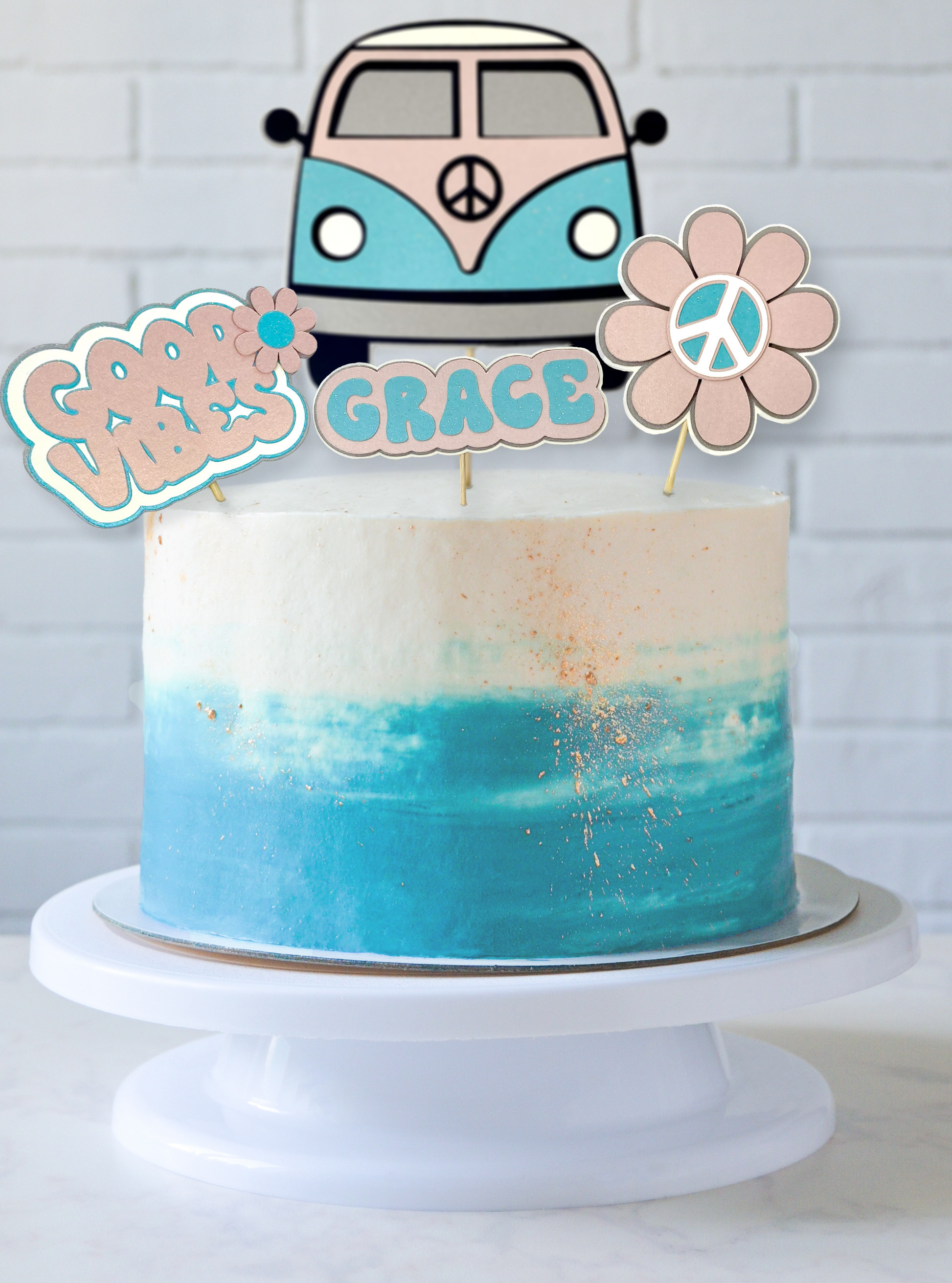 Blue and cream birthday cake with campervan cake topper and personalised name cake topper