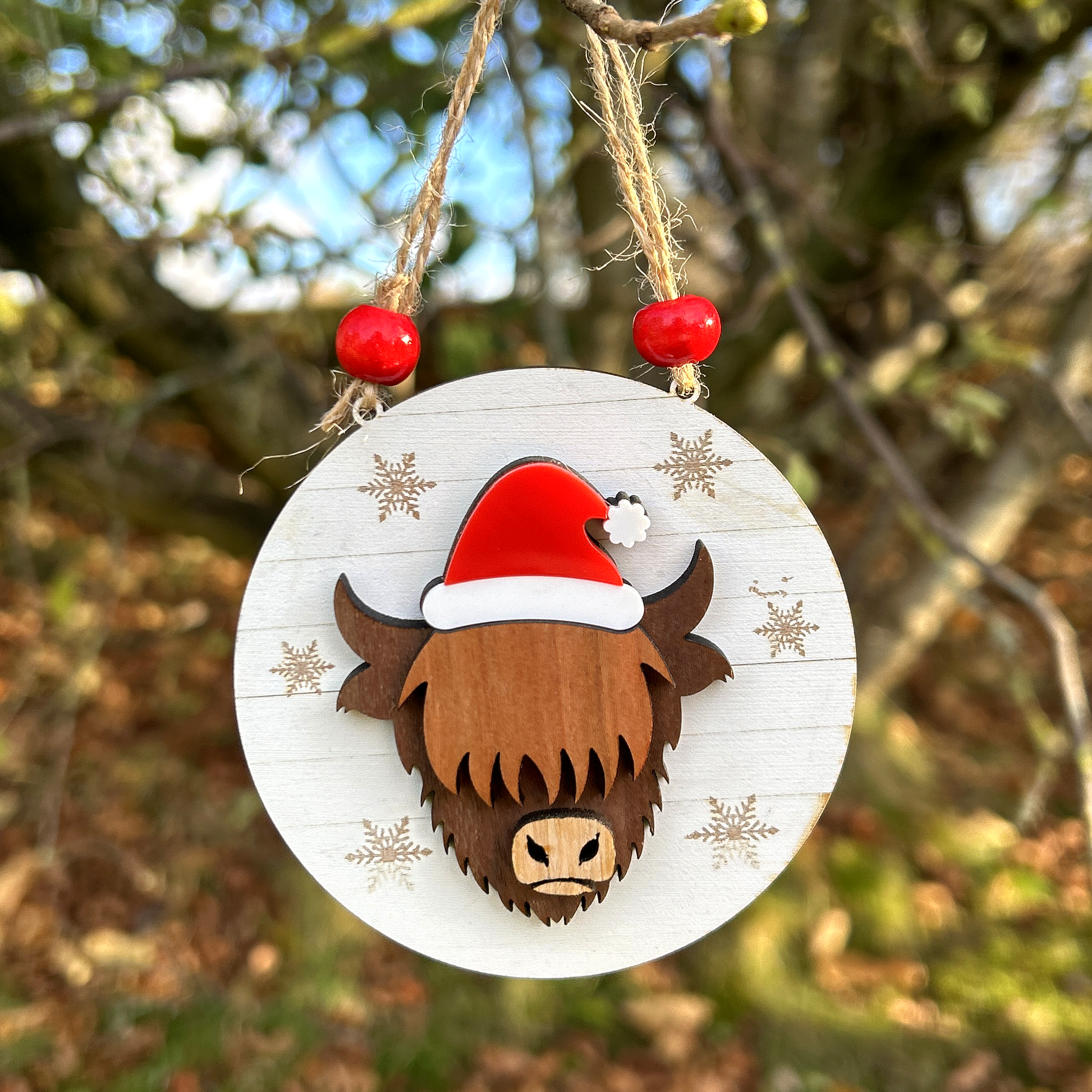 Highland Cow Christmas tree decoration with Santa hat